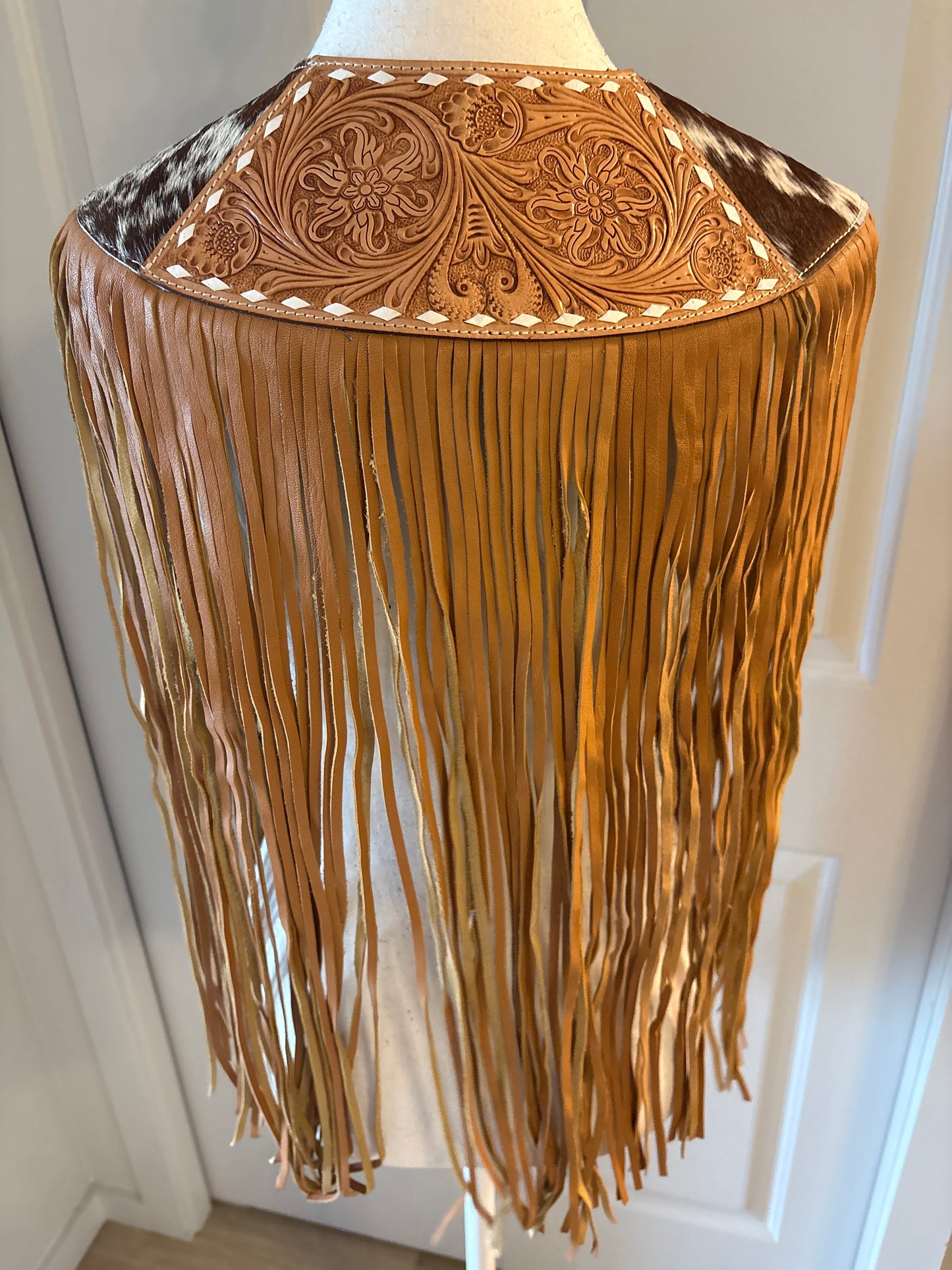 Handtooled hide fringe shawl tan