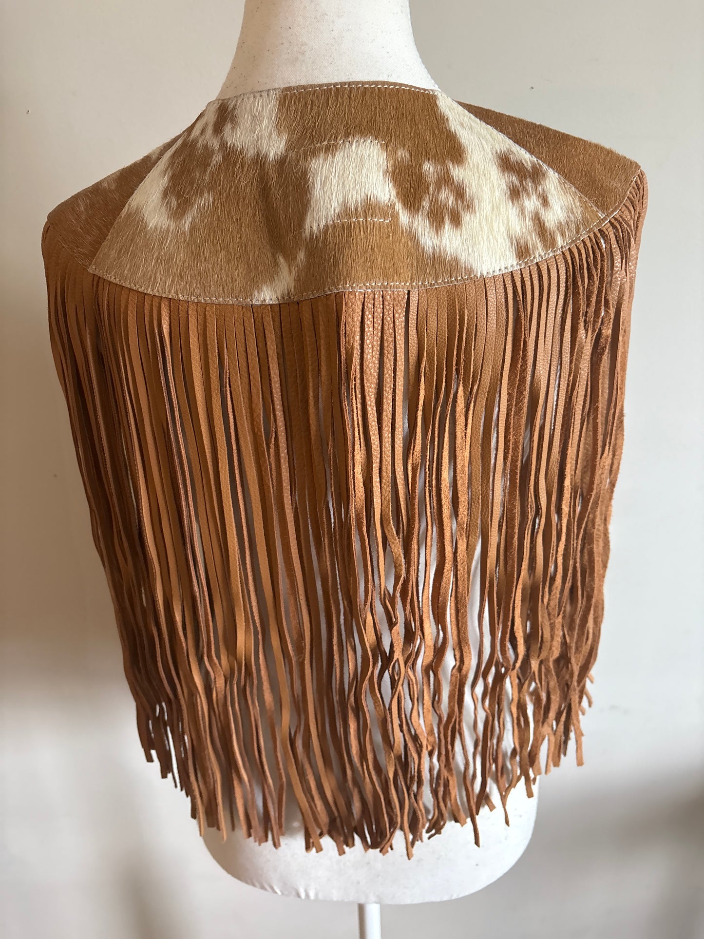The fringe cape in tan