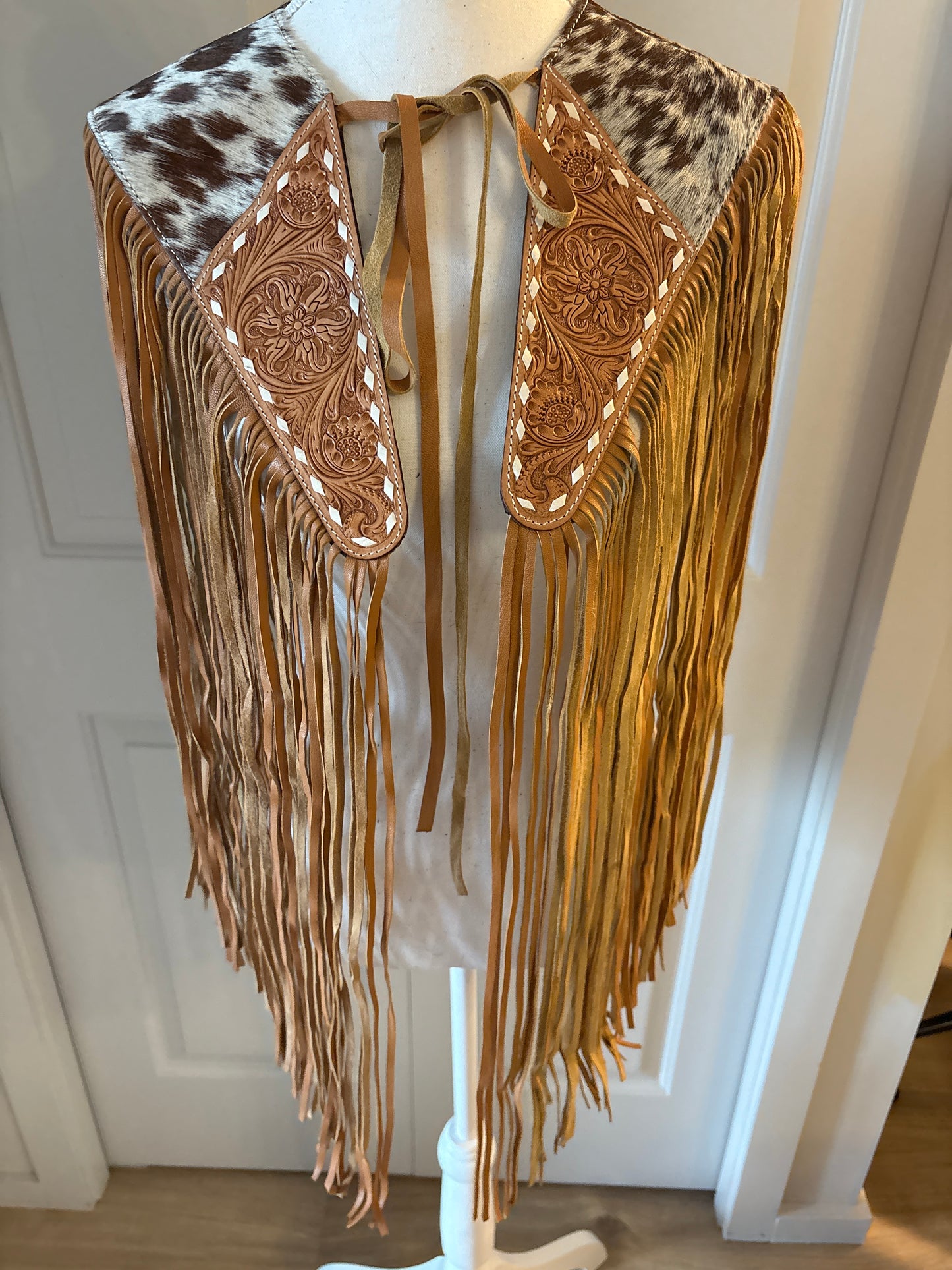 Handtooled hide fringe shawl tan