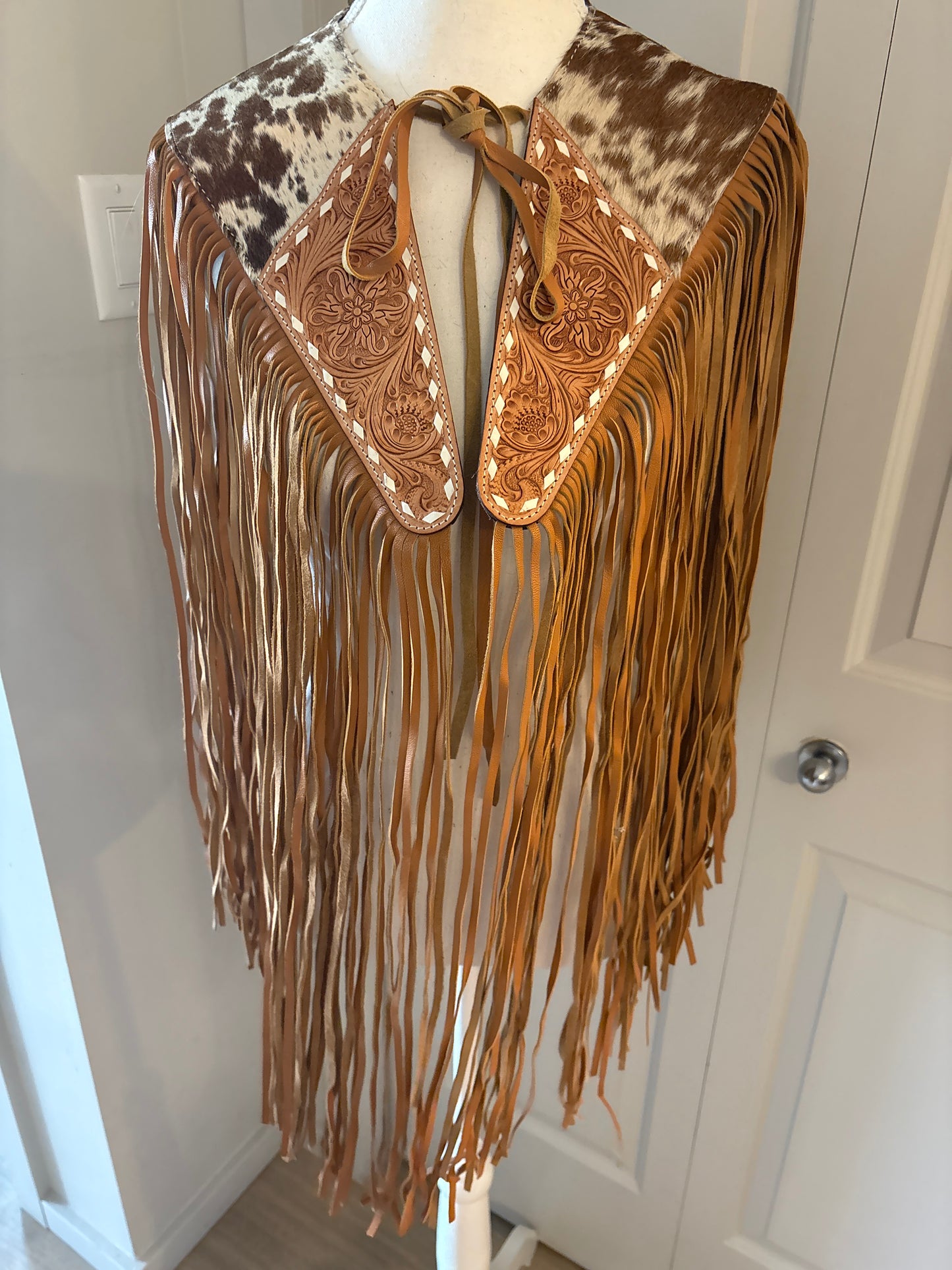 Handtooled hide fringe shawl tan