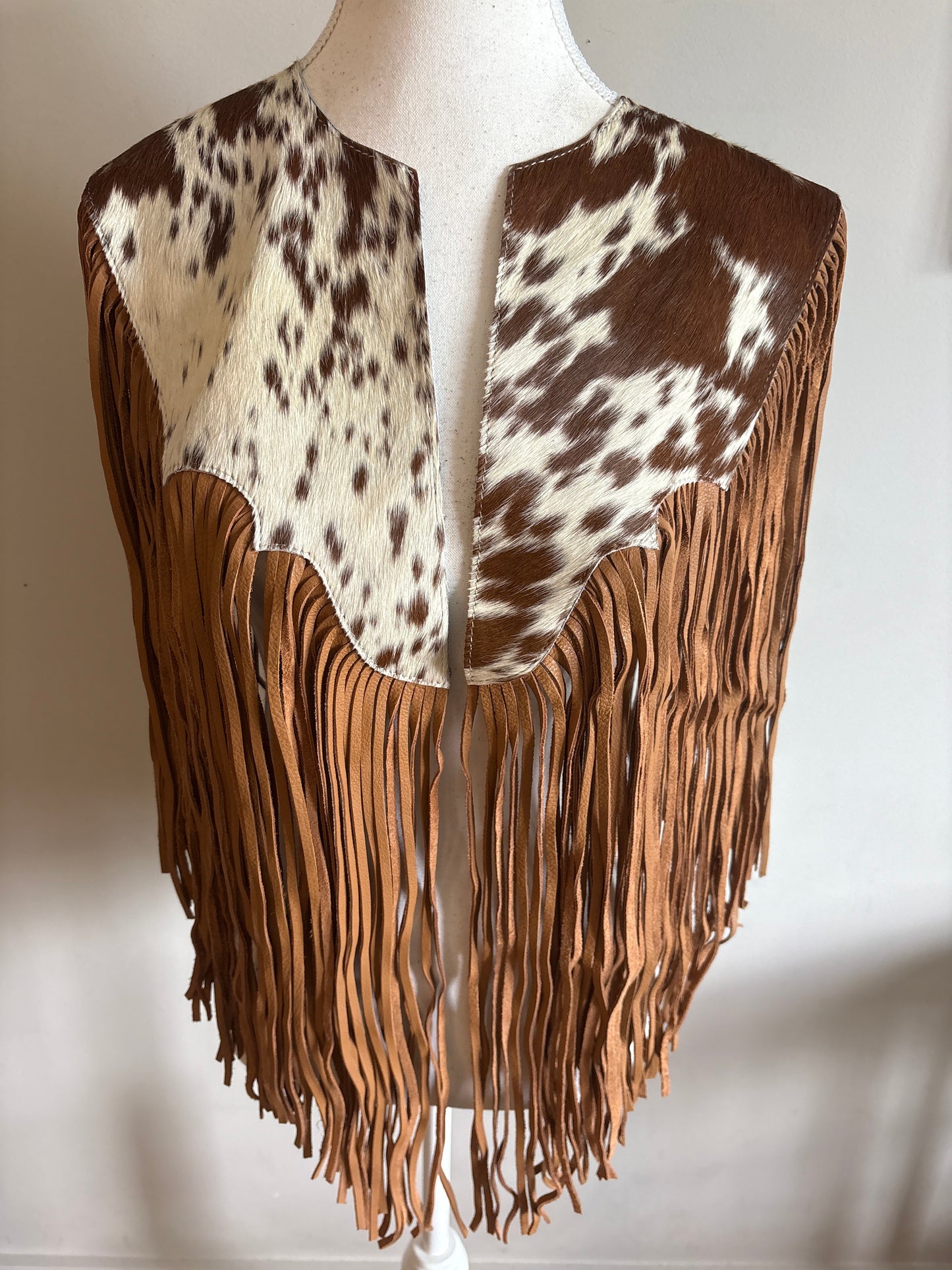 The fringe cape in tan
