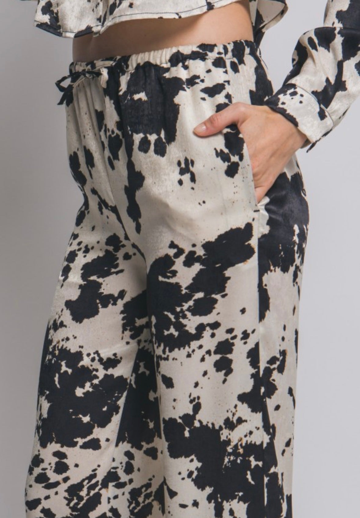 Cow print pants in black