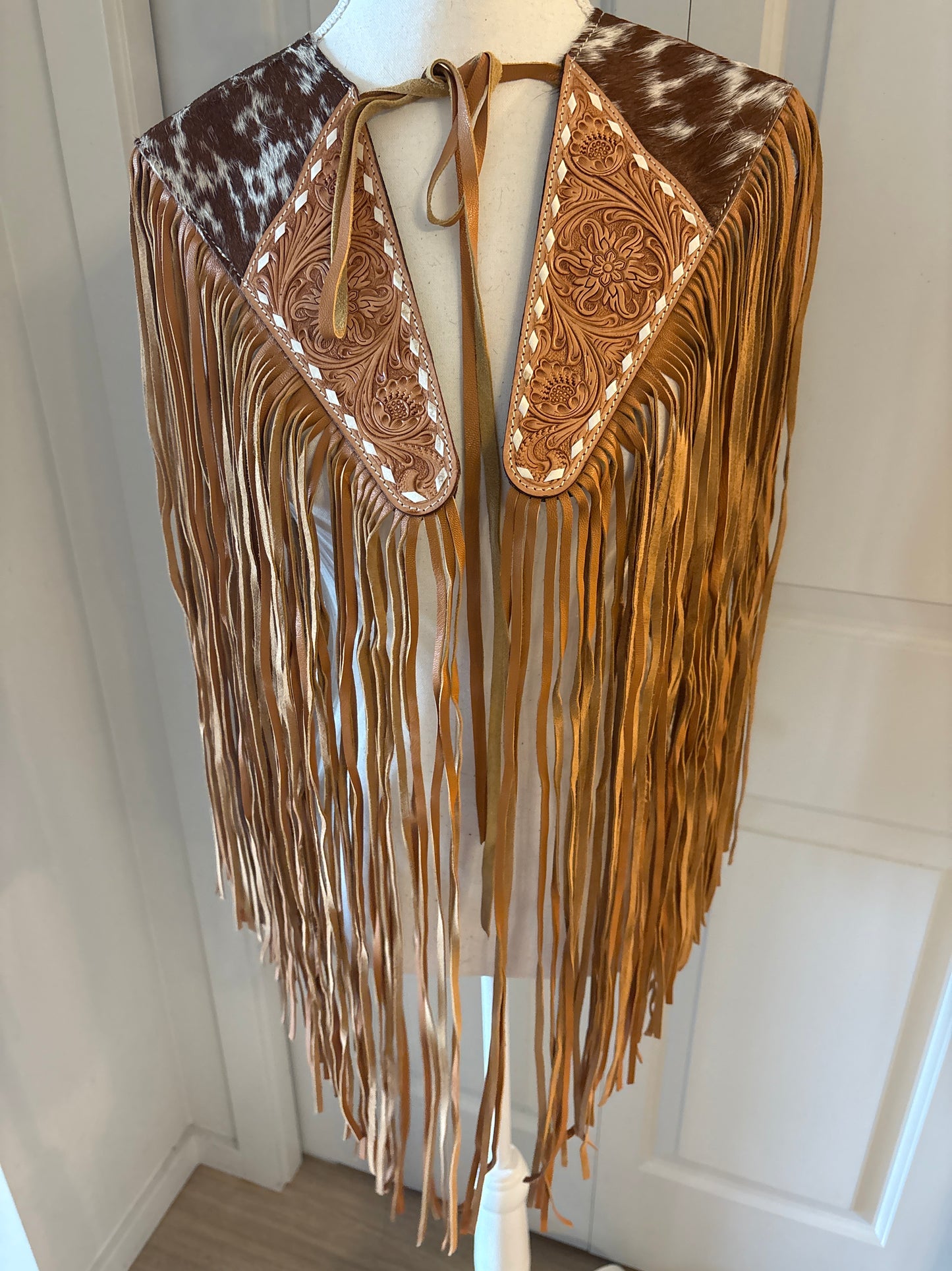 Handtooled hide fringe shawl tan