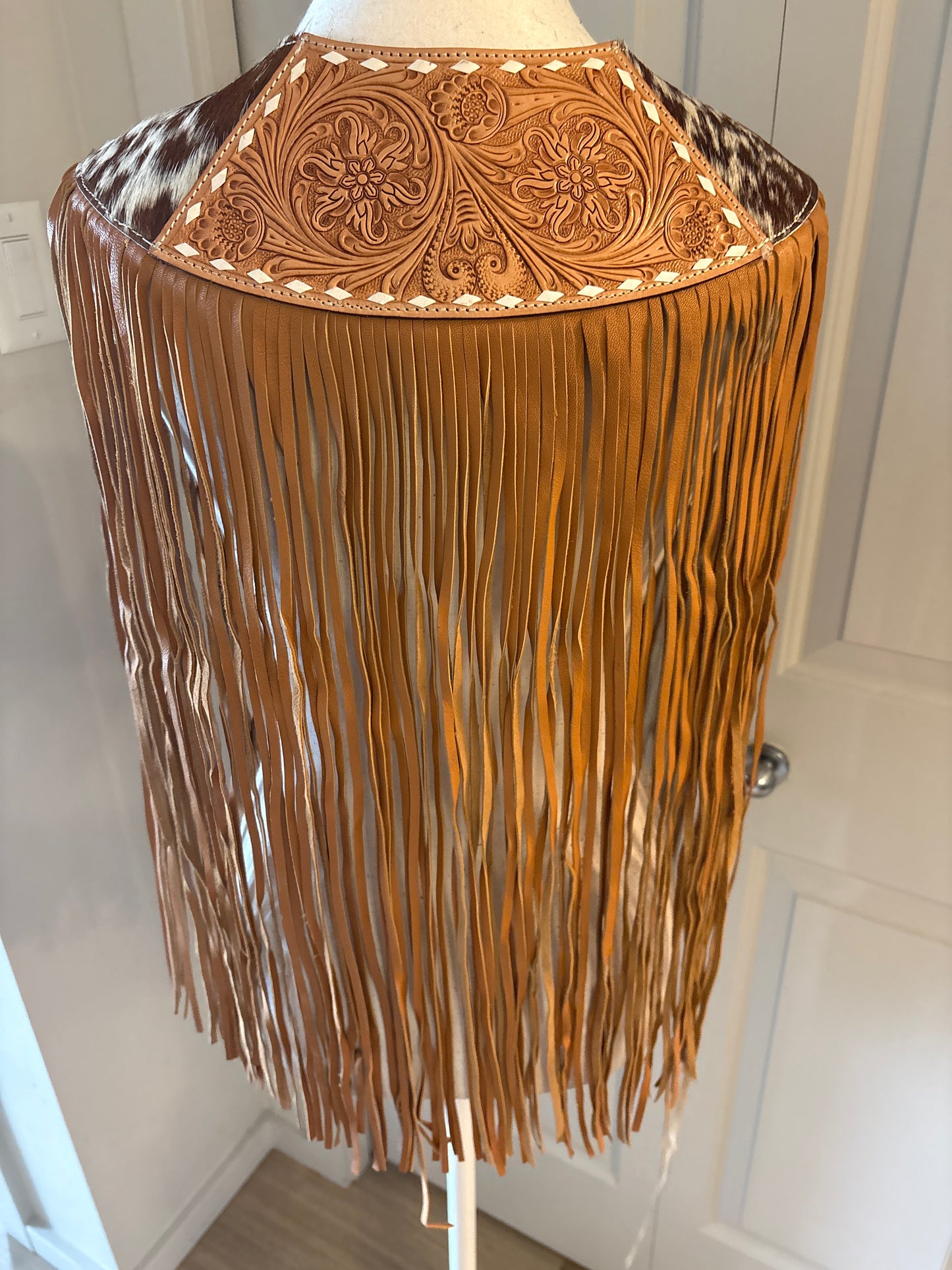 Handtooled hide fringe shawl tan