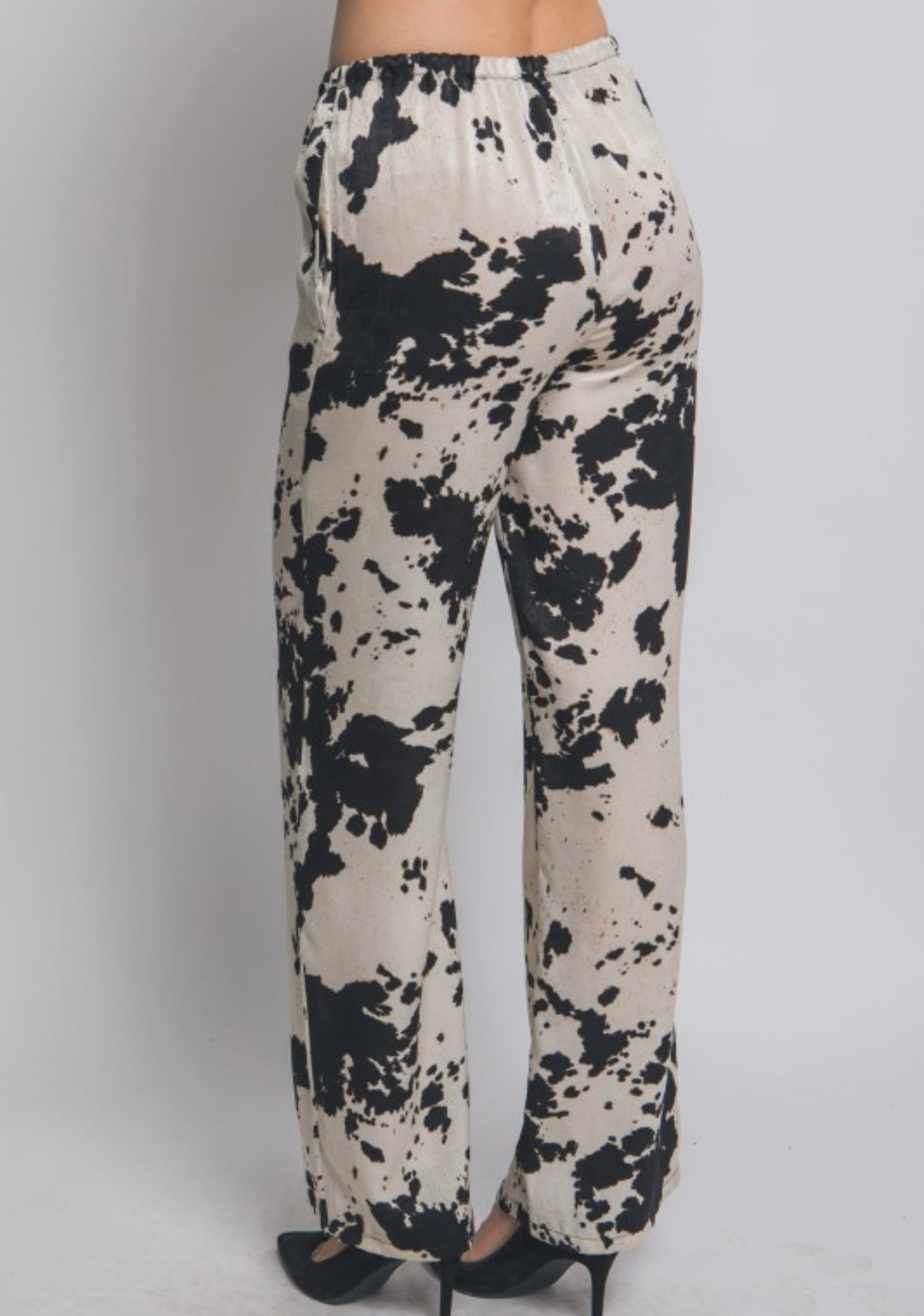 Cow print pants in black